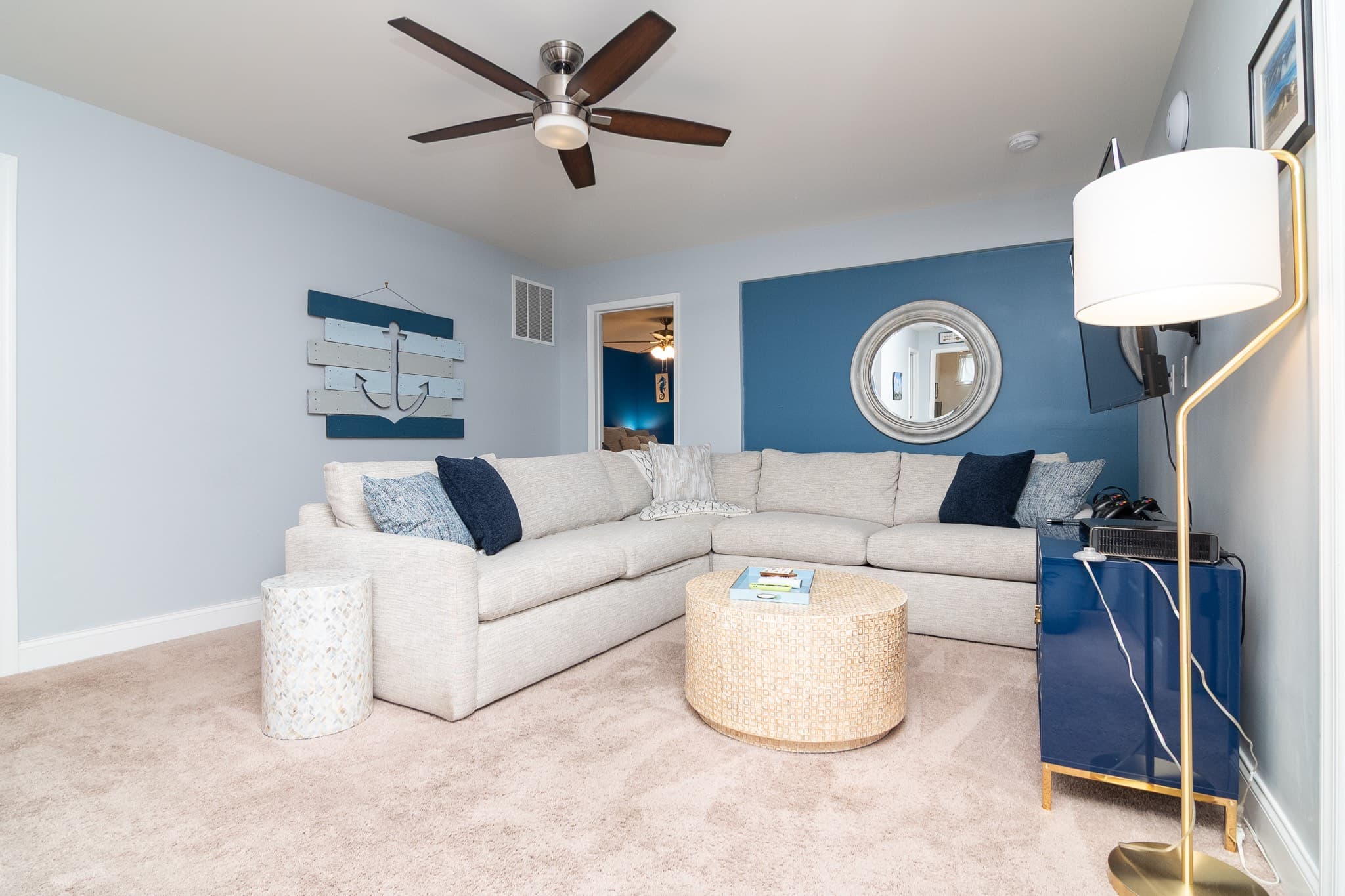 This second-floor family room serves as a bonus lounge with a new, comfy sectional sofa with a queen sleeper sofa and smart TV with cable/streaming. Perfect for extra sleeping space, family movie nights, or relaxing with games.