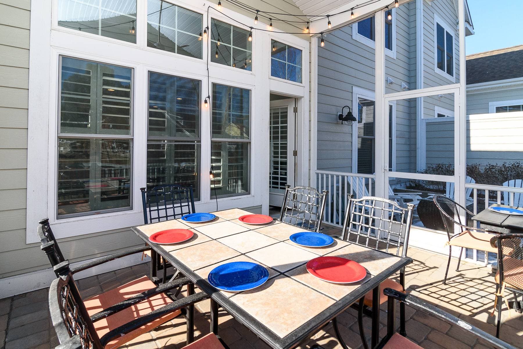 The screened in porch and patio are easily accessed through the first floor family room. It can be a fun place to enjoy a barbecue, play games, or to chat with your friends and family. String lights add more fun on the porch.                                  