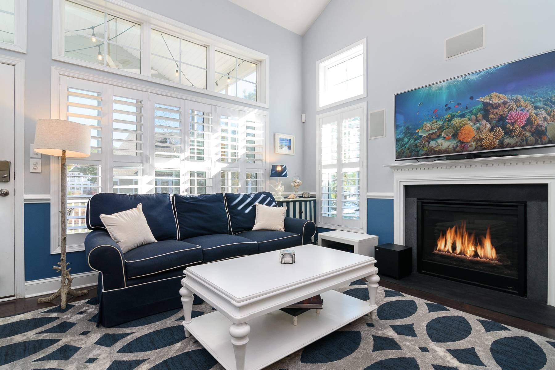 You will enjoy relaxing in this  floor family room while watching your favorite movie or tv show on the large screen smart tv with cable.  There is also a dvd player. Plenty of DVDs are available upstairs. Notice the gas fireplace under the tv too.