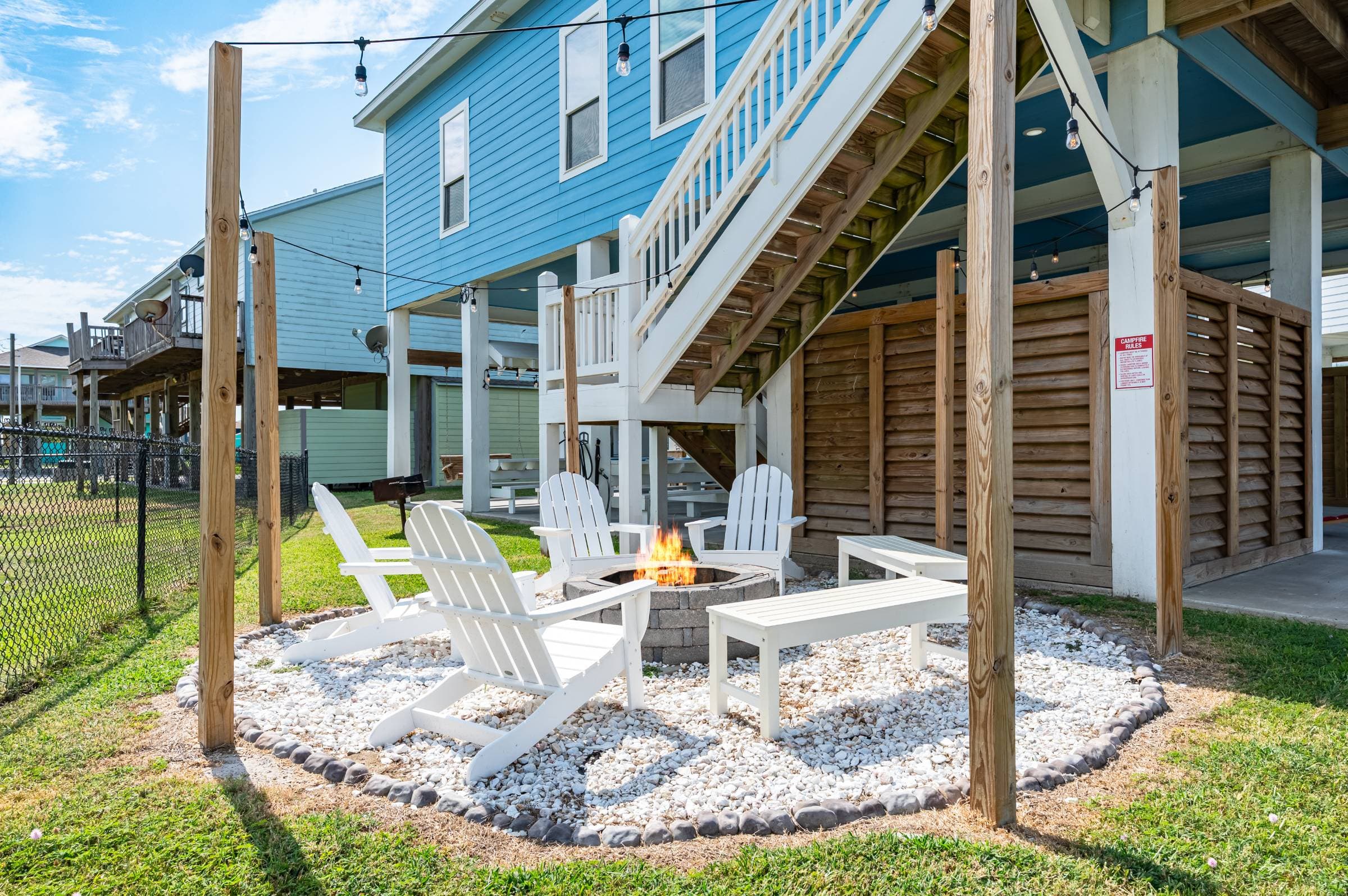Cozy up by the fire pit at Crystal Waters Beach House—complete with Adirondack chairs, benches, and string lights. Perfect for s’mores, stories, and starlit nights! Be sure to pick up firewood at a nearby store.